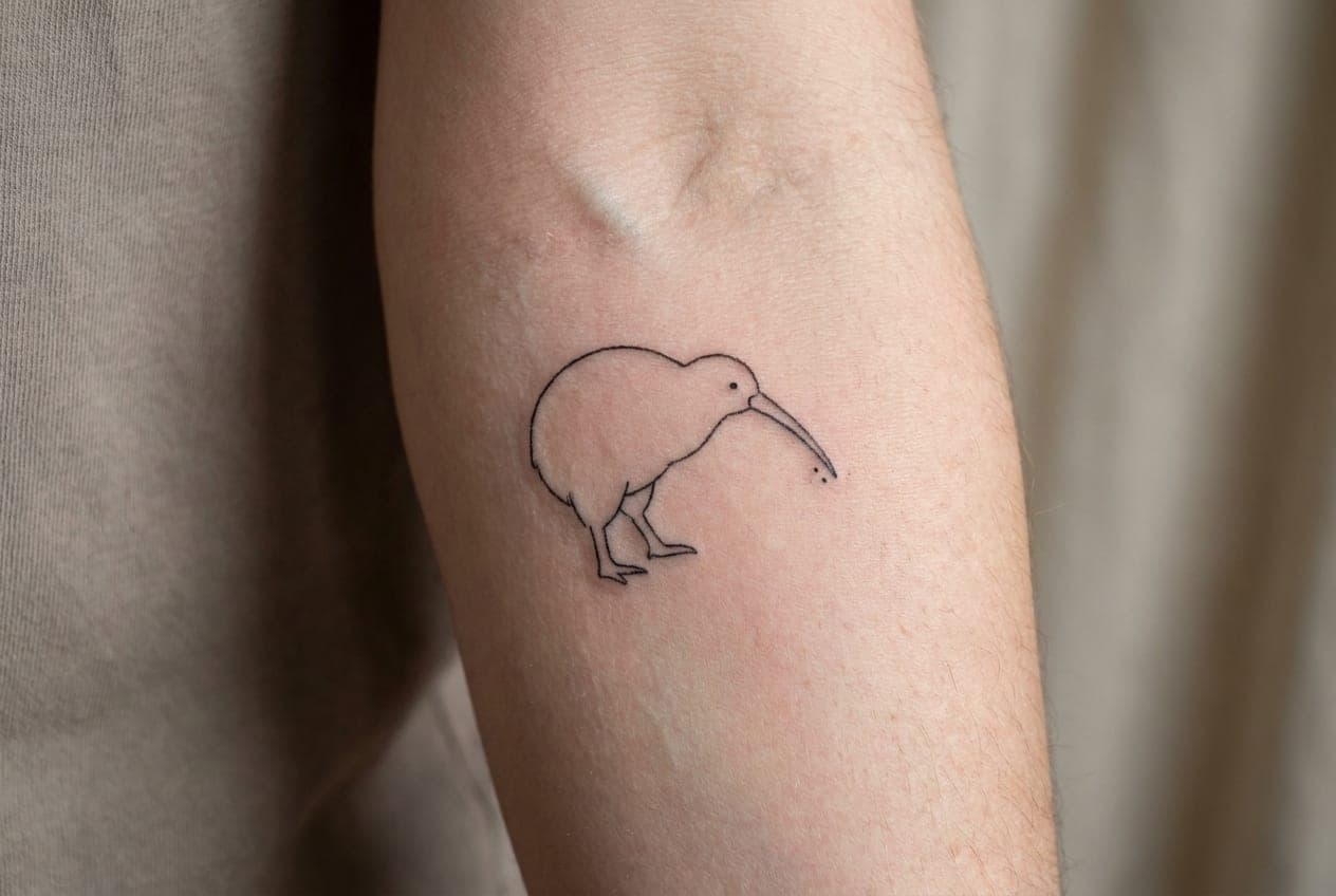 Small fine line kiwi bird tattoo on the inside of a forearm